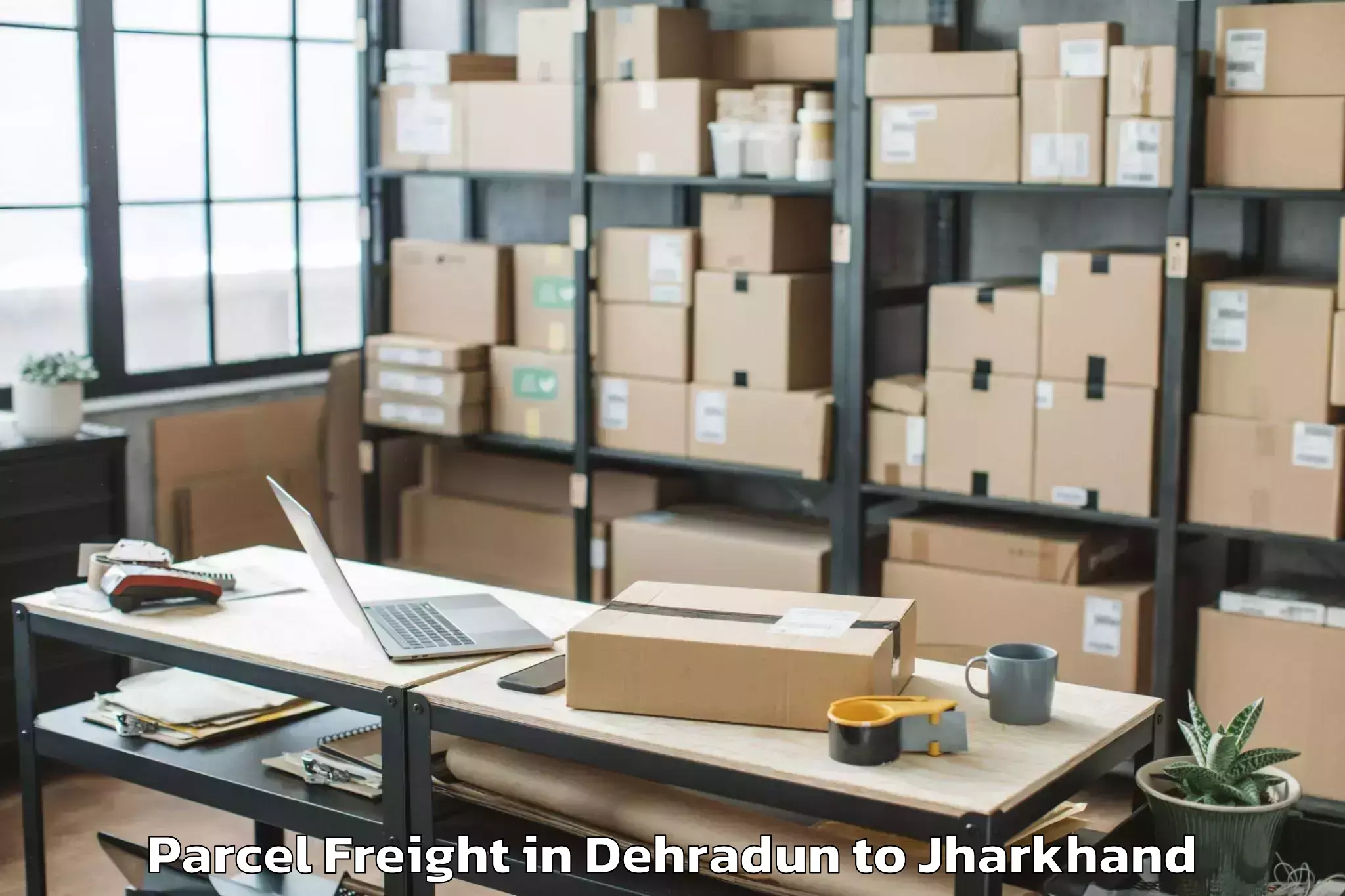 Book Dehradun to Jharkhand Raksha Shakti Univer Parcel Freight